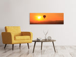Leinwandbild Panorama Heissluftballon bei Sonnenuntergang