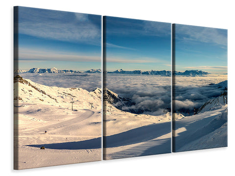 Leinwandbild 3-teilig Über den Wolken im Schnee